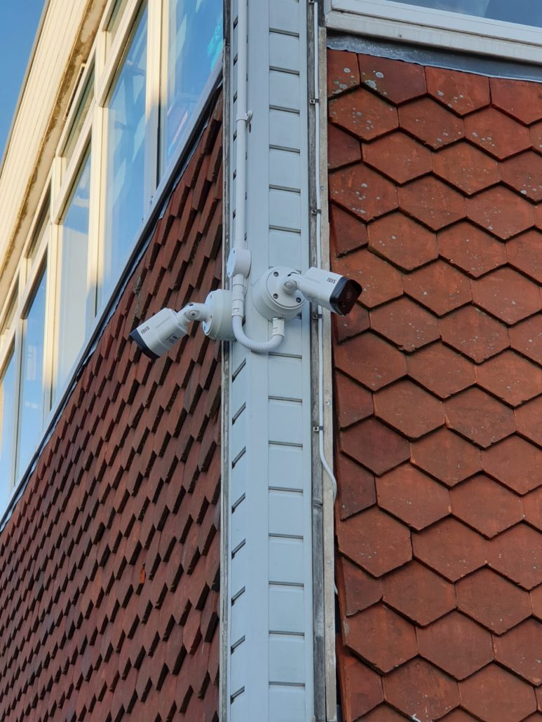 two cctv cameras pointing other ways