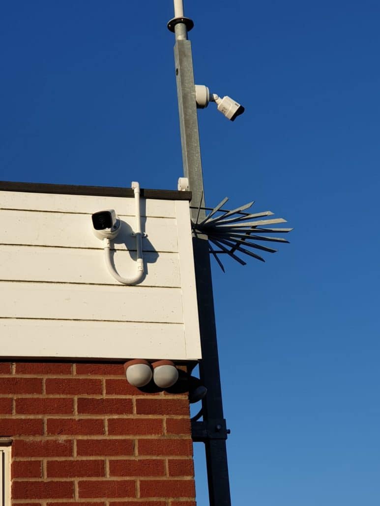 single camera against a blue sky