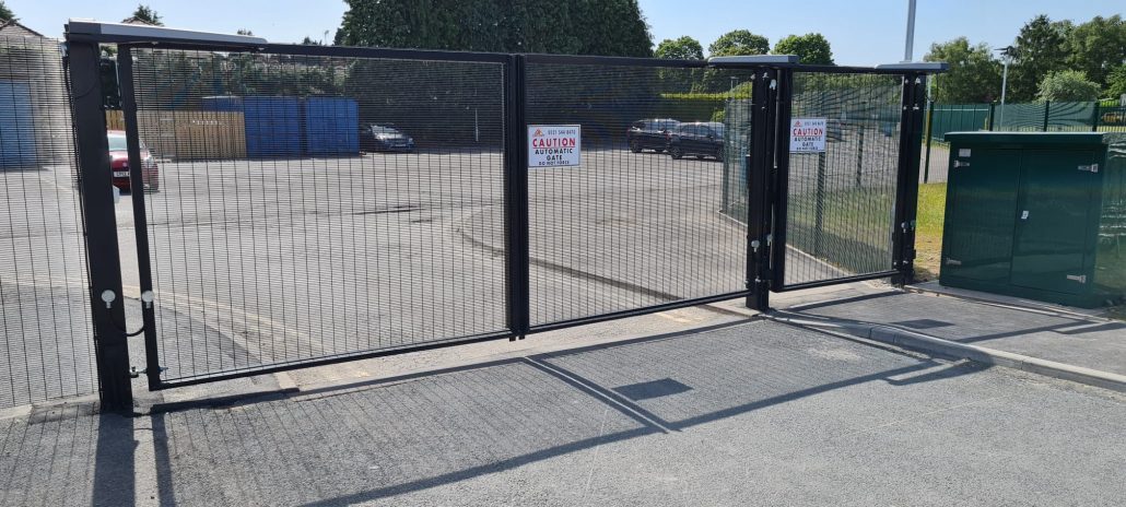 Black automatic gate fitted by Unison CCTV